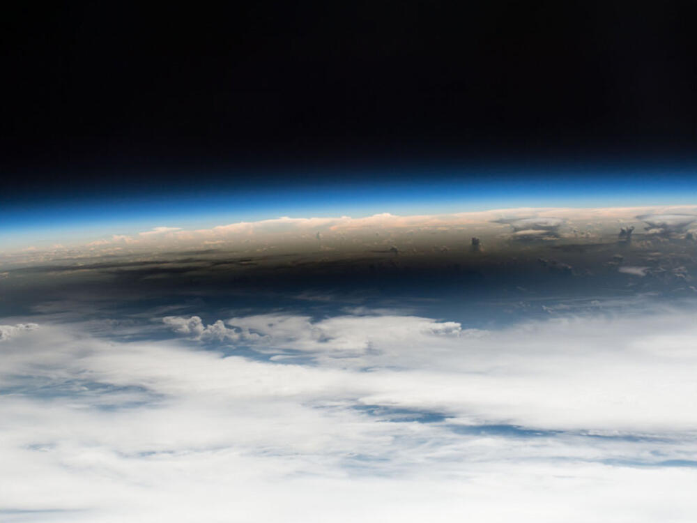 View of the horizon cutting between space and earth.